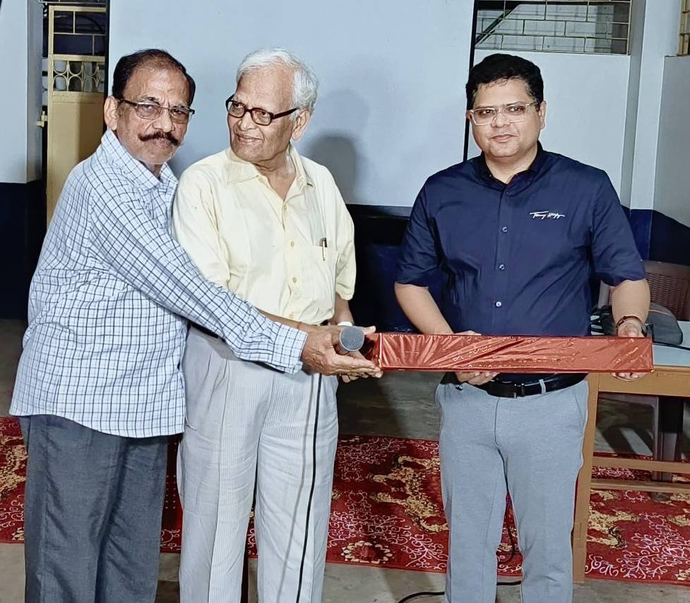 Dr. Shovan Kumar Rath presenting an recognition during a chronic pain awareness event at Senior Citizens Forum, Cuttack
