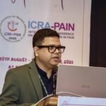 Dr. Shovan Kumar Rath speaking at International Pain Conference 2025, representing Pain Free Odisha and sharing advances in pain management